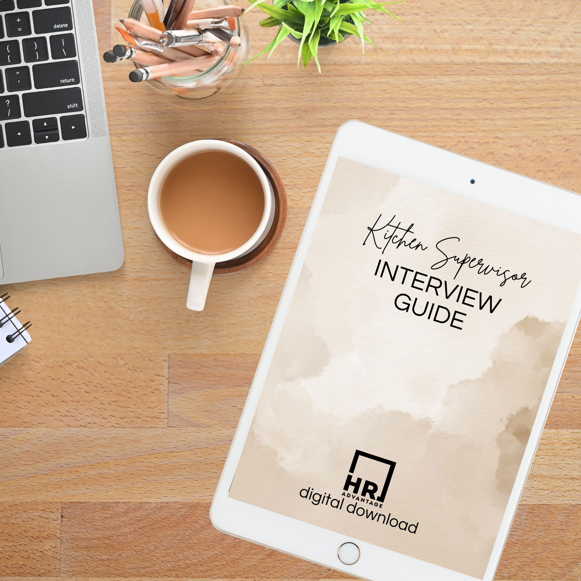 Computer and tablet displaying a digital template titled 'Kitchen Supervisor Interview Guide,' showcasing a professional document layout for HR use